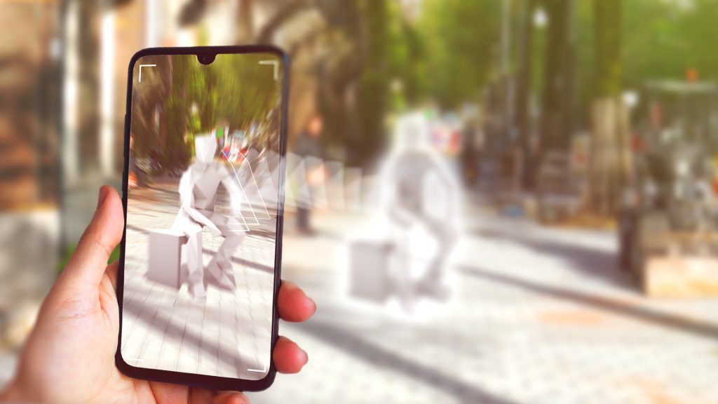 Mixed reality experience seen through a smart phone, showing a statue in an urban setting.